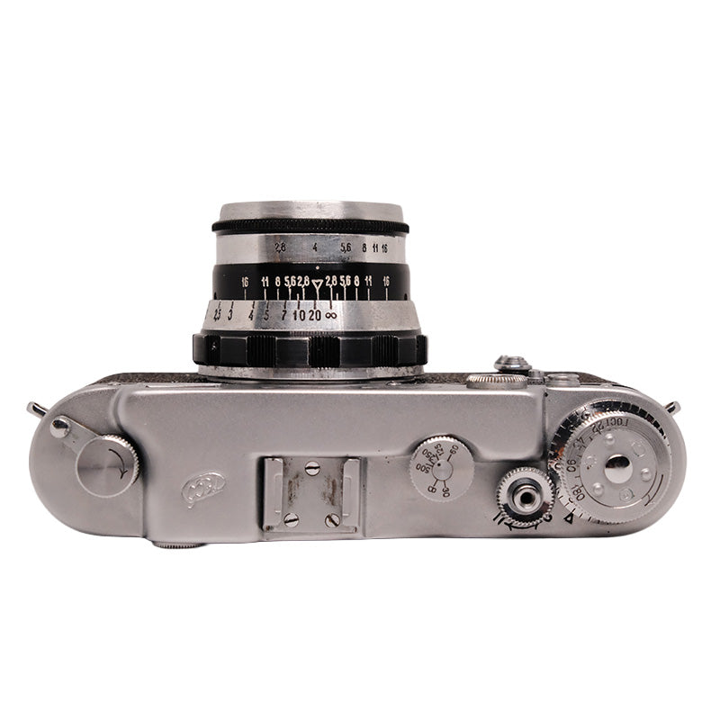 FED 2 rangefinder camera with Industar N-61 53mm f/2.8 lens, vintage camera and lens set on a neutral background.