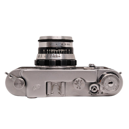 FED 2 rangefinder camera with Industar N-61 53mm f/2.8 lens, vintage camera and lens set on a neutral background.