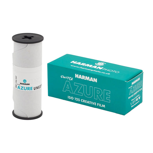 Comutator Harman Switch Azure 120, dispozitiv electronic cu buton de control, alb și albastru, pentru sisteme audio și automatizări.