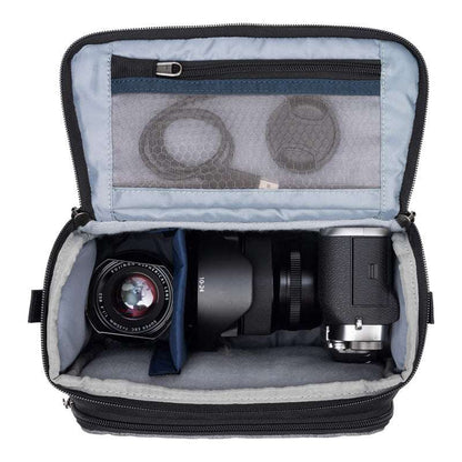 Cool grey ThinkTank Mirrorless Mover 20 v2 camera bag with adjustable shoulder strap and padded compartments.