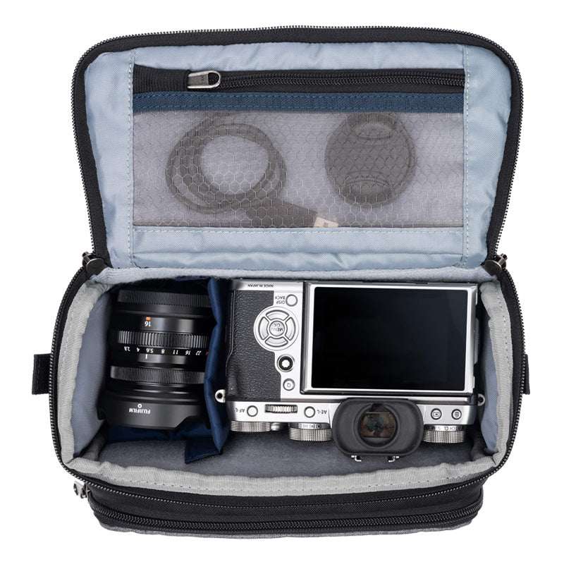 Cool grey ThinkTank Mirrorless Mover 20 v2 photo bag with adjustable straps and multiple compartments for camera gear.
