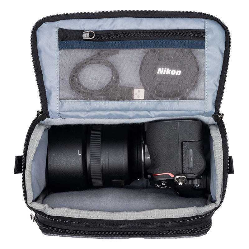 ThinkTank Mirrorless Mover 20 v2 in Cool Grey, showcasing a compact camera bag with adjustable strap and organized pockets.