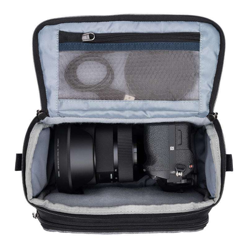 ThinkTank Mirrorless Mover 20 v2 bag in Cool Grey, showcasing exterior design and storage compartments for camera gear.