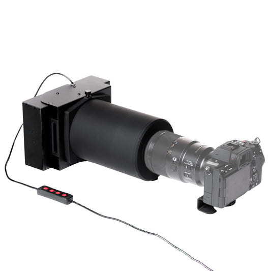 Valoi Easy120 film scanner on a wooden table, showcasing its sleek design and user-friendly interface.